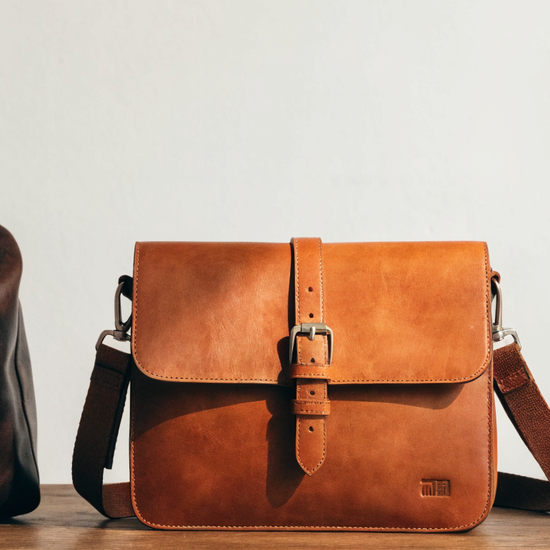 Tuscany Leather bags banner: duffle, crossbody, and briefcase