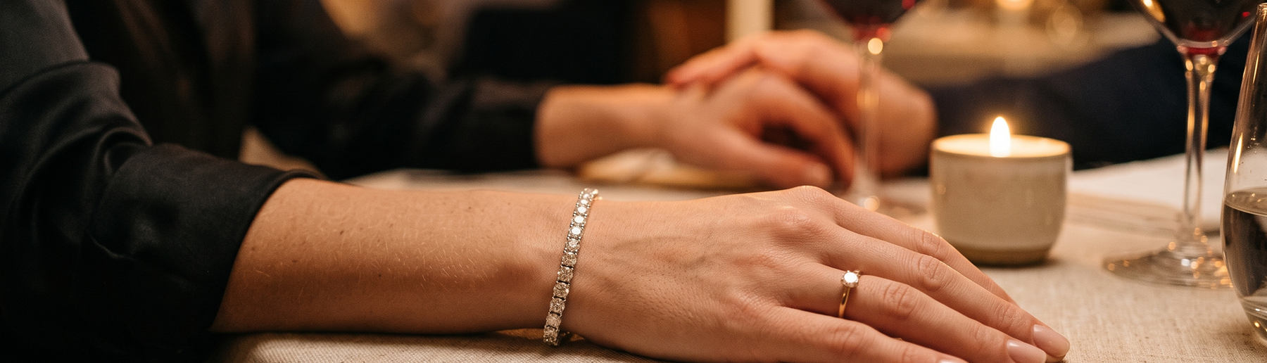 Woman wearing a lab grown diamond tennis bracelet at an anniversary dinner