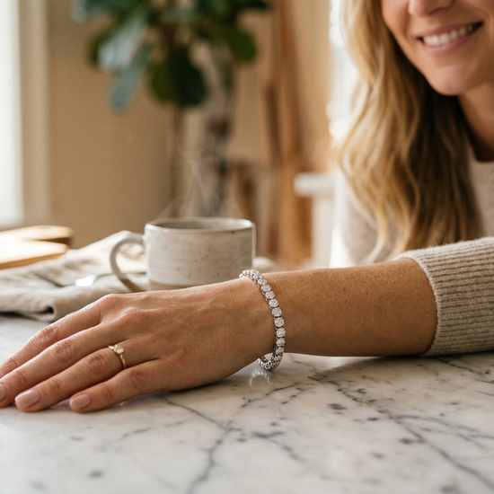 Woman wearing a lab-grown diamond tennis bracelet in natural light