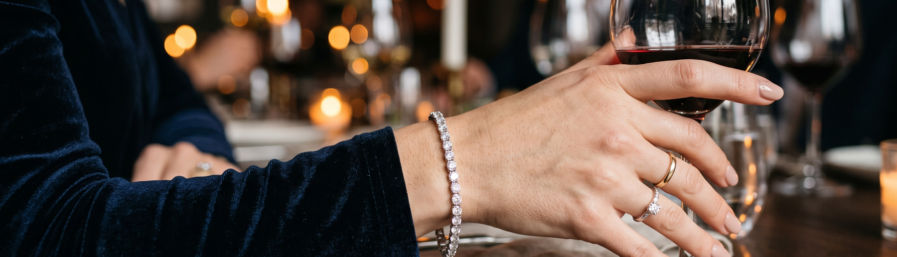 Woman's wrist wearing a sparkling lab-grown diamond tennis bracelet on a Valentine's Day date night
