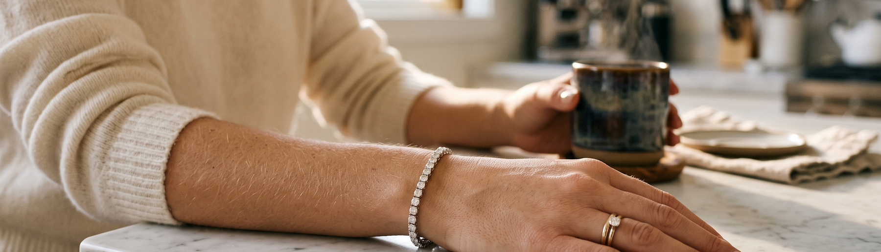 Woman wearing a lab-grown diamond tennis bracelet in natural morning light