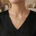 LADIES PENDANT 0.15CT ROUND/BAGUETTE DIAMOND 10K YELLOW GOLD