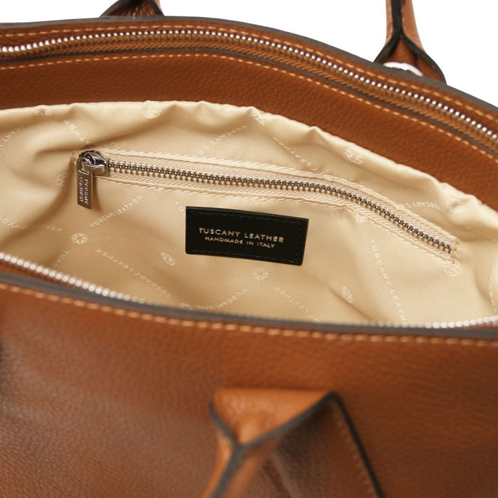 Viva brown pebbled leather handbag interior with zip pocket and Tuscany Leather label.
