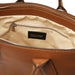 Viva brown pebbled leather handbag interior with zip pocket and Tuscany Leather label.