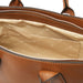 Viva brown pebbled leather handbag interior with open slip pocket.